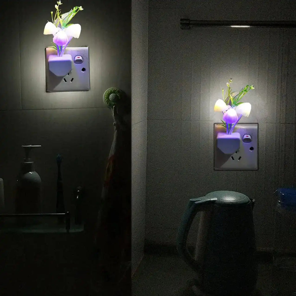 Flower-shaped night lights attached to wall sockets in a bathroom setting.